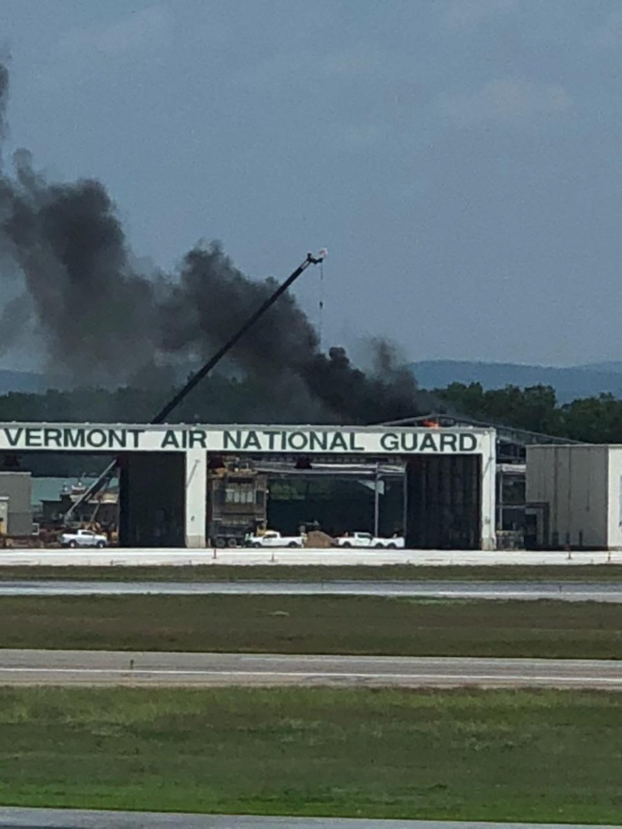 StewartVT's tweet photo. Thick black smoke wafted over the #BTV airport Monday when a welding accident set a @VTNationalGuard hangar on fire. 
https://t.co/HXTl7JzLnF
#vt #F35 https://t.co/sABqlvw0Tn