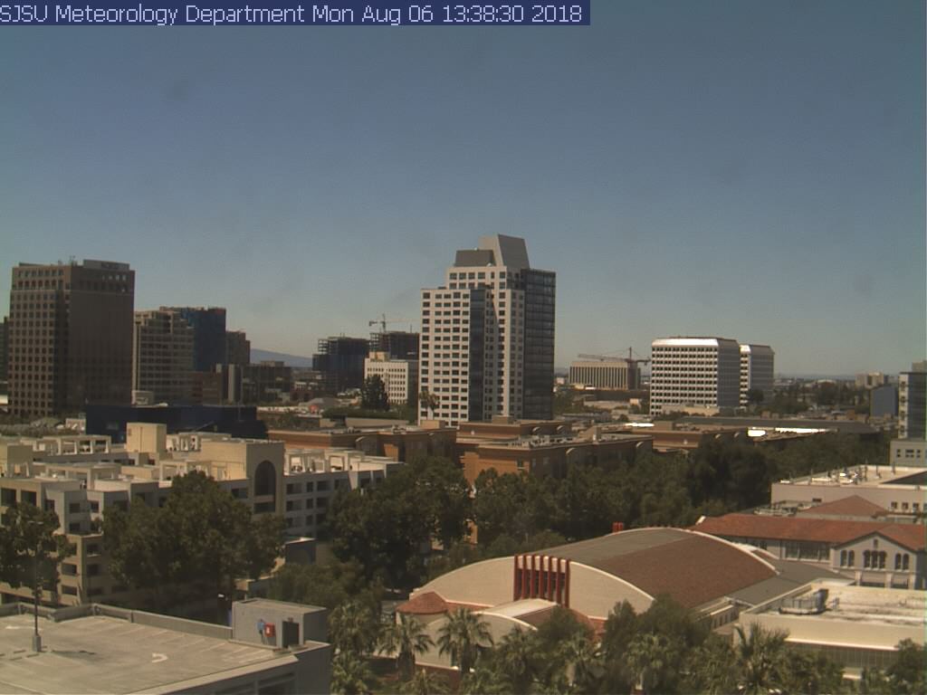 SJSUmeteorology's tweet photo. #wildfire #smoke clearly seen from the east-facing #cam on #DuncanHall at #SJSU. But skies clear to the north from the north-facing cam. Thanks to an #onshore #breeze. #cawx @NWSBayArea @MarkTamayoKTVU @RobMayeda https://t.co/pqzw0BS0uS