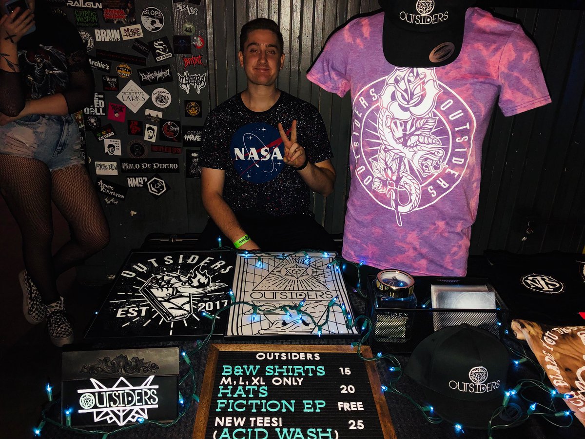 The merch table is out of this world tonight! Stop by and pick up your new swag from Collin’s handsome face. 👽🌚⭐️ #badomens #outsiders #clubred