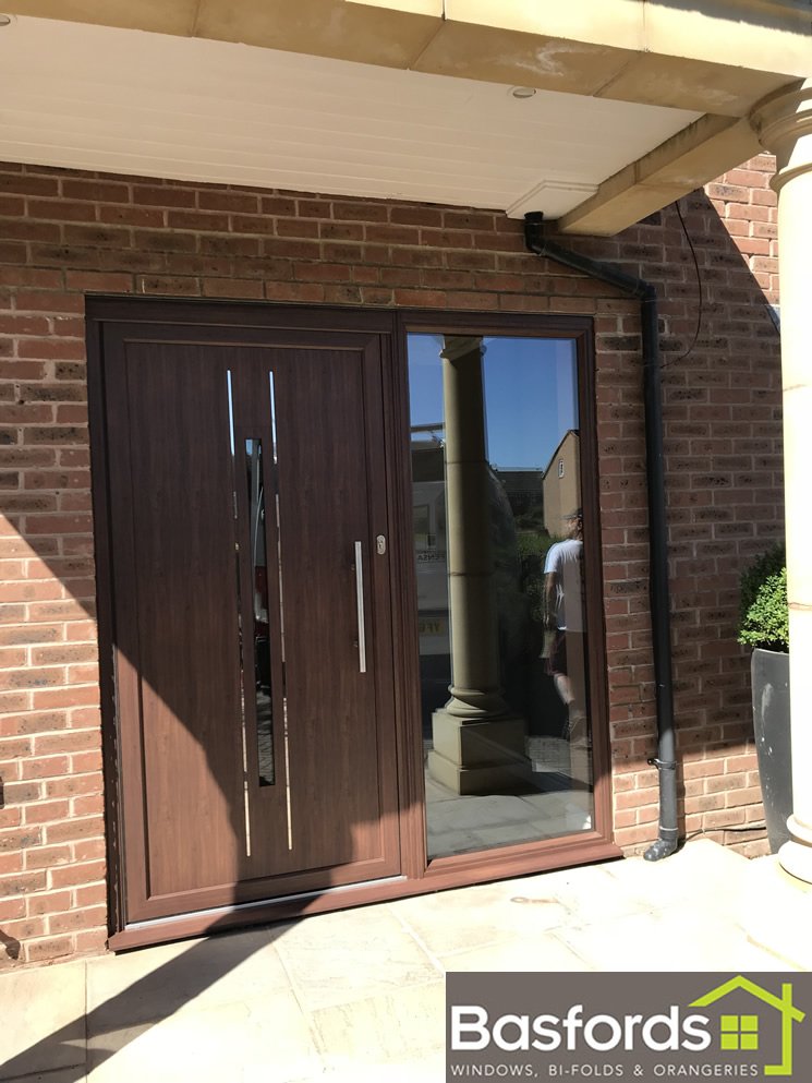 This Walnut <a href="/Originbifolds/">Origin Global</a> Residential Door with side panel made the perfect addition to this customers houses, allowing plenty of natural light to flood their hallway. #Origin #OriginDoors #ResidentialDoors #Doors #Basfords #Walnut #naturallight #BasfordsEffect