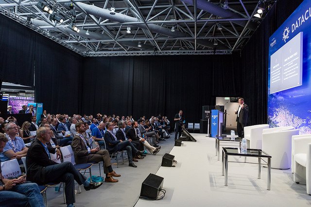DatacloudGlobal's tweet photo. #TBT @VertivCo_UK's Rob Johnson addressing a full house at the recent Datacloud Europe on 'Defining the Edge' https://t.co/UfsUU5poKD #DCE18 #datacenters #cloud #Edge https://t.co/bgb7LH5TXC