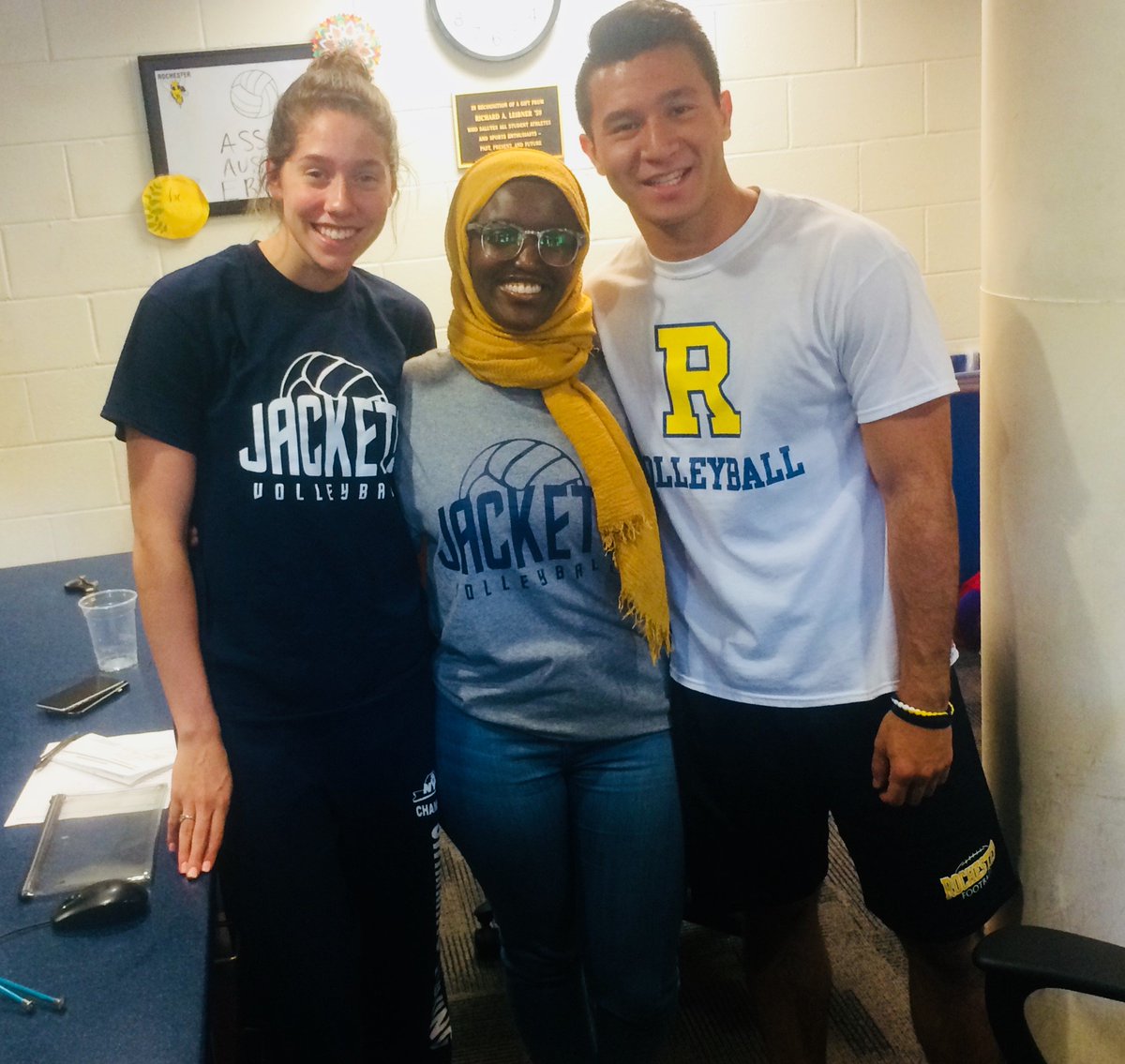 UR_Volleyball's tweet photo. Goergen Athletic Center front desk staff, Erica, Assia, and Austin representing UR volleyball today for team spirit week at the GAC ! 😍 #meliora #GAC #URVB #spiritweek #beststaffever https://t.co/stCluPQQ0A