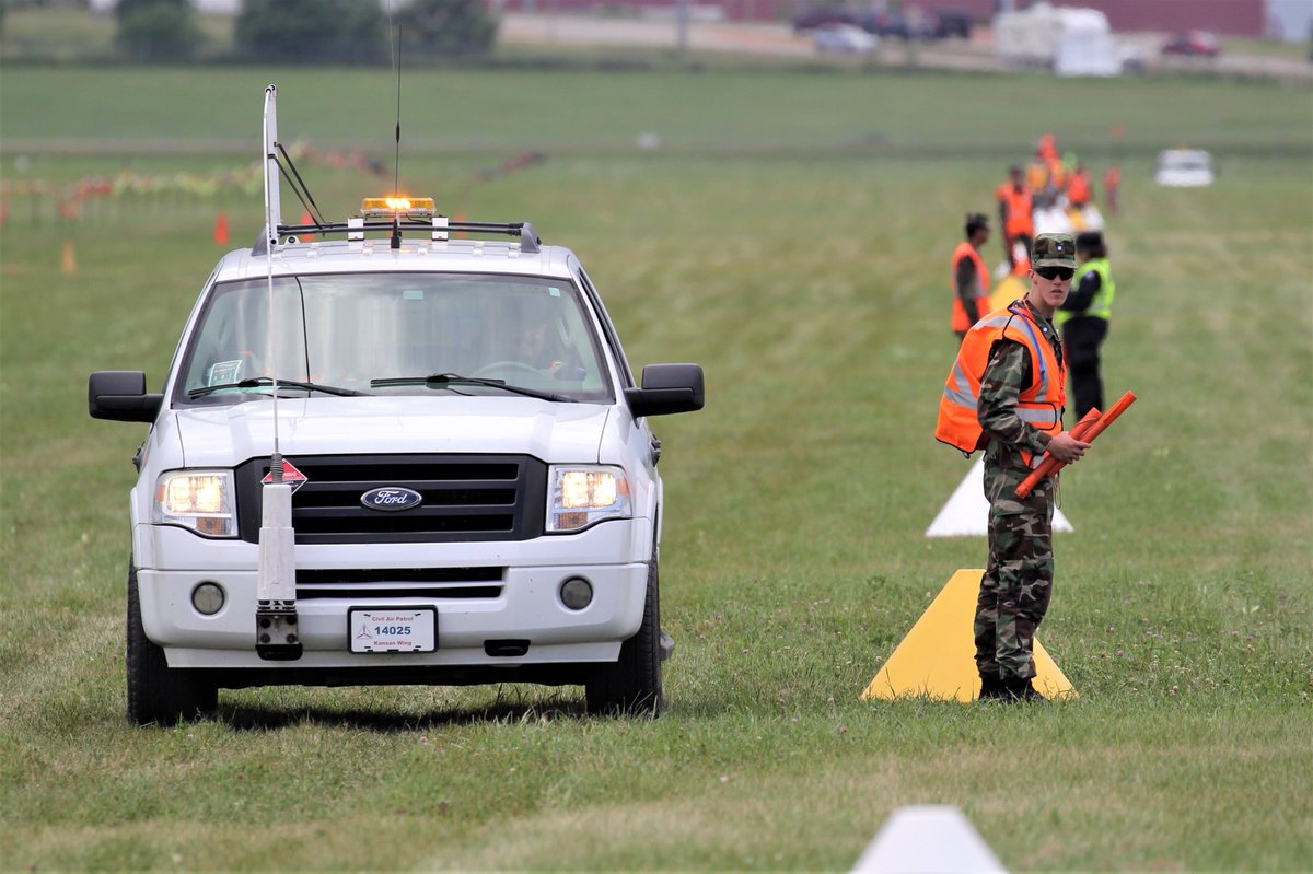 CivilAirPatrol's tweet photo. CAP cadets keep visitors to Oshkosh safe on the flight line at Wittman Field #NationalBlueBeret #EAA https://t.co/A92IOUiGIn
