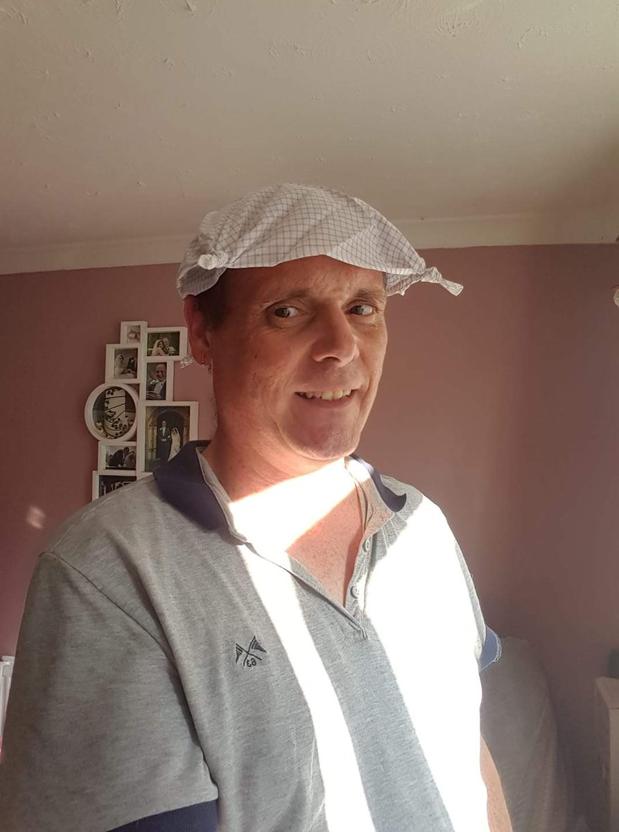 Ah the classic English look, socks with sandals and a knotted hankie.