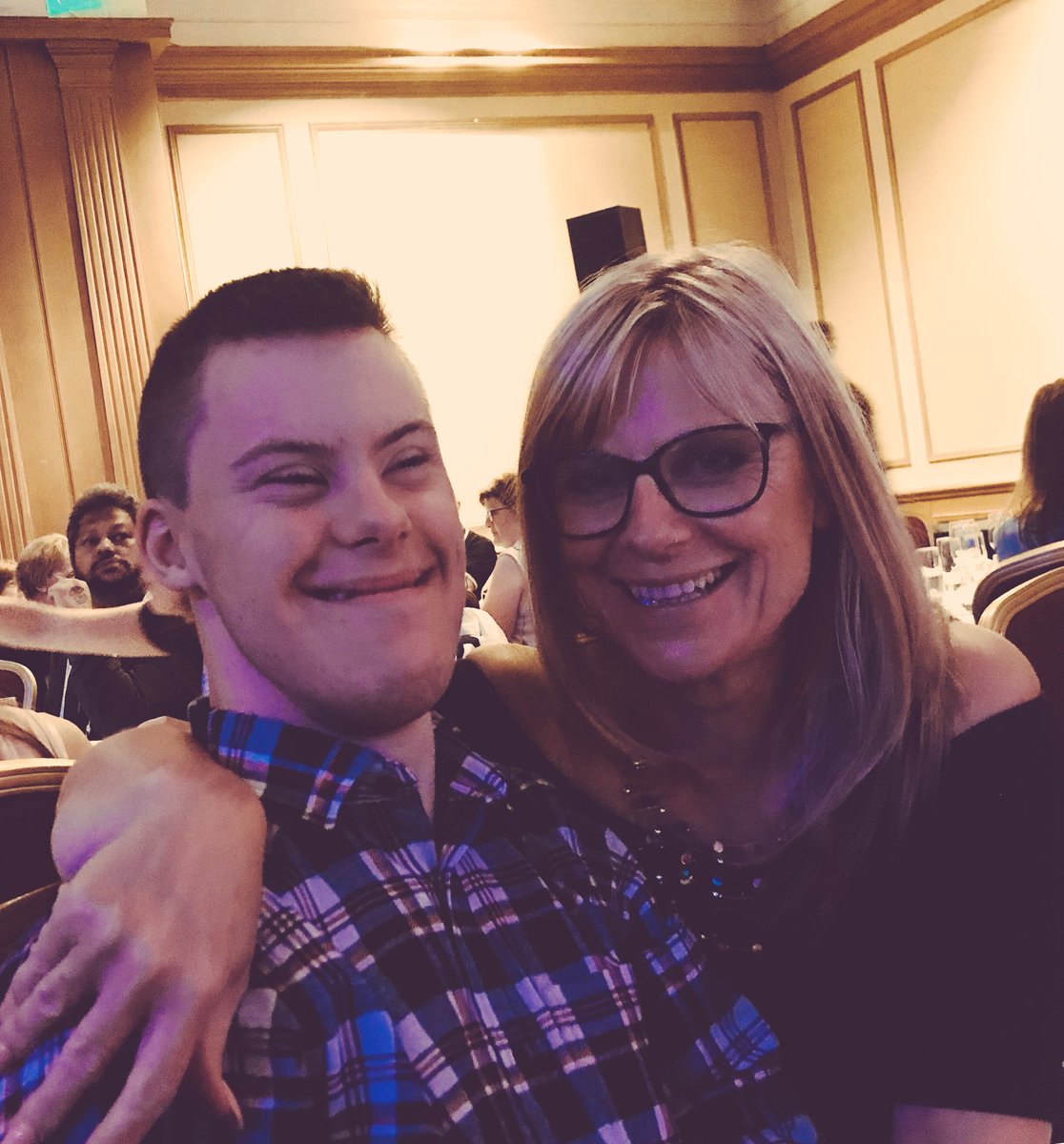 sarahhoss's tweet photo. It’s a lovely night in Glasgow. I’m at the #wdsc2018 which is the world’s biggest convention of people with Downs and their fans. I’m the lucky lady with this young man on my arm. #Downssyndrome #futureofdowns @Future_Of_Down @downinfrontpls @freeyaarose1 https://t.co/8v4Dildg12