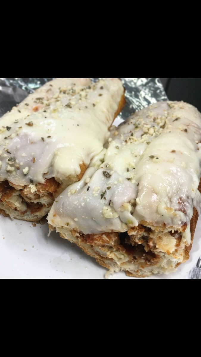 Panichellis_Piz's tweet photo. Hand breaded Chicken Parmesan sub ready to be wrapped and go out the door. 
Our chicken breast is breaded and cooked fresh upon ordering, topped with marinara sauce, and melted mozzarella, sprinkled with some parmesan and oregano, all on an oven baked bun. 
#newbern #newbernnc https://t.co/lPmCVi5Ve4