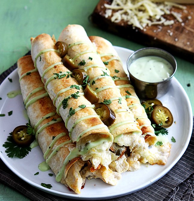Drive_Warren's tweet photo. Do you feel like spicing up dinner tonight? Try these slow cooker jalapeño popper chicken taquitos. https://t.co/2BWVe6U0oG https://t.co/8vl9Gez3Tc