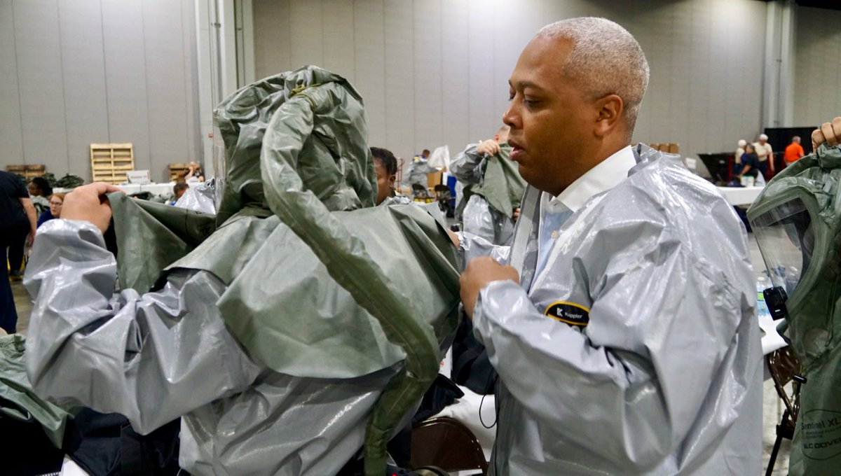 ASPRgov's tweet photo. NDMS responders are getting hands-on training on life-saving #PPE at #NDMS2018.  These responders are learning to put on PPE the right way so they are protected if they are called on to respond to a chemical, biological, radiological or nuclear disaster. https://t.co/ic1bgqOuZR