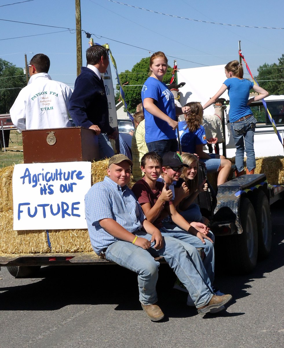 With #OrchardDays just days away, we are taking it back to the #Santaquin celebration of 2011.  Pictured are Payson High School Future Farmers of America (FFA) students riding in the grand parade.  

#tbt #throwbackthursday #phslions #paysonhighschool #ffa #futurefarmersofamerica