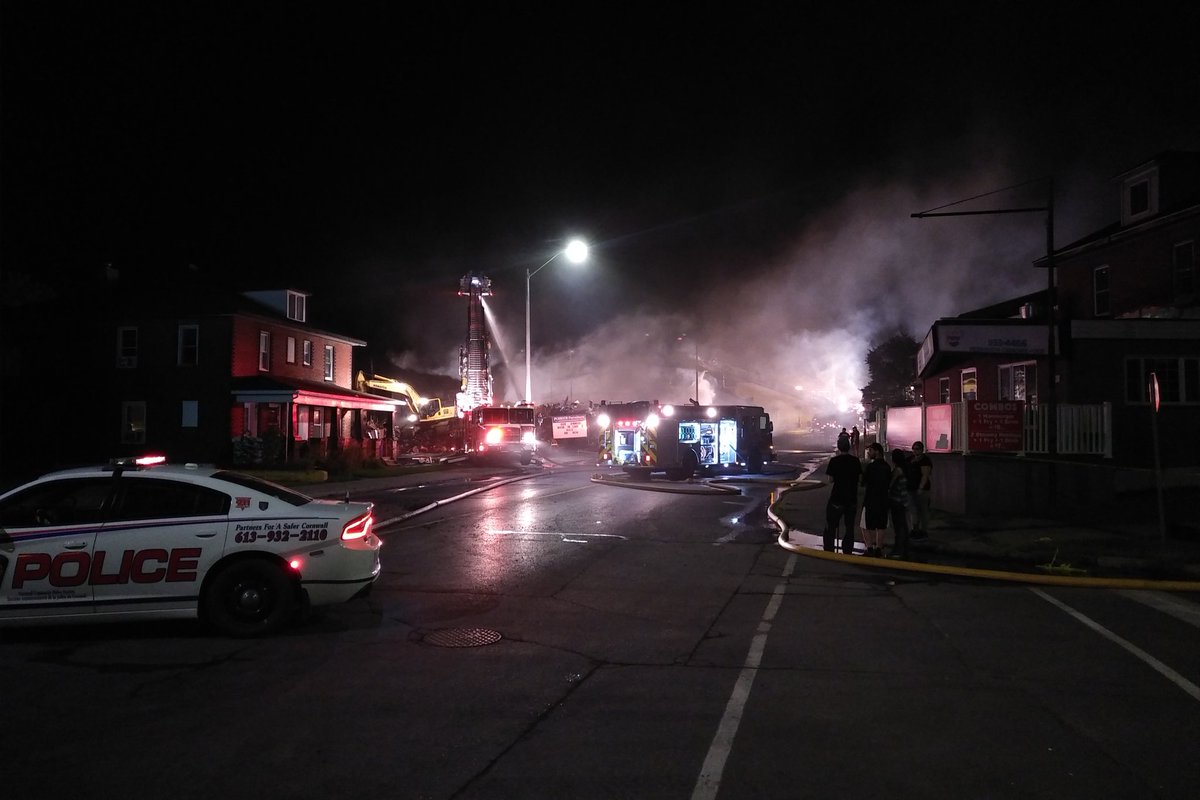 The scene as of 2:21am. Hi-Hoe still working at moving debris as firefighters put out hot spots. #CornwallON #fire https://t.co/TF7SGamoAD