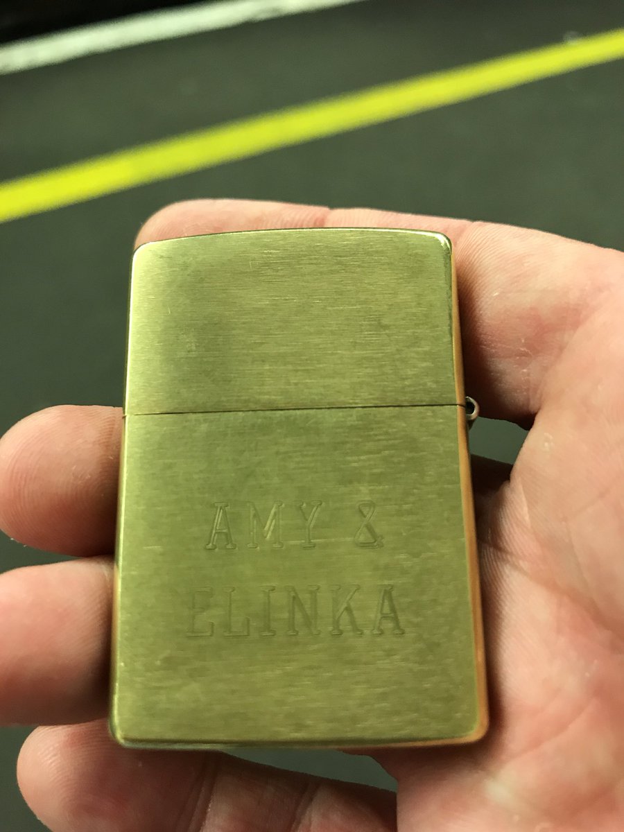 Willduggan's tweet photo. So I’ve found a zippo at the end of the Victoria line at Walthamstow Central. Got a nice engraving too. I imagine someone wants it back. Be nice to share this about, eh? https://t.co/k6BNklk8U3