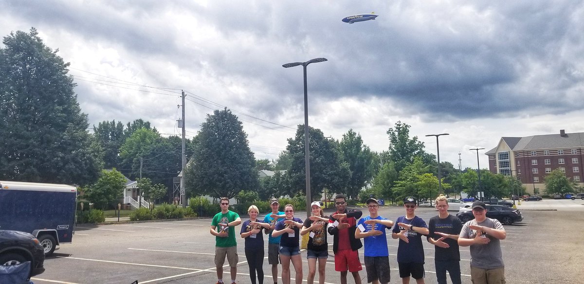 Akron_NSO's tweet photo. What an opportune time for the @GoodyearBlimp to make an appearance! Sending off our Akron Adventurers in style. Have fun White Water Rafting and camping this weekend! ๐ถโบ @UAkronRec #LeftOverRight #OfficialZip https://t.co/buKgt3xWwD
