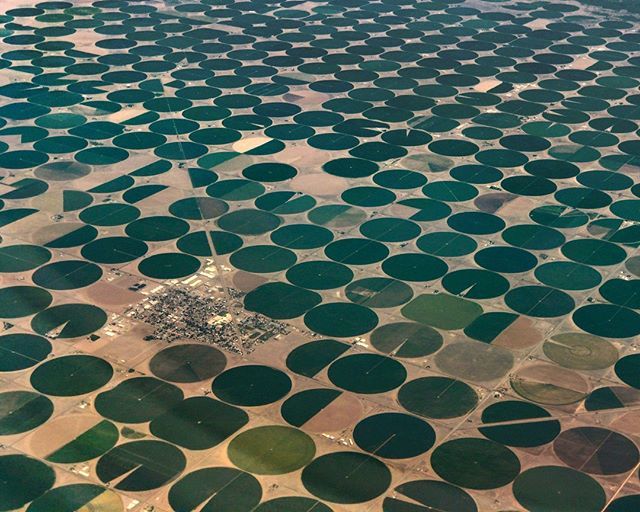 MicrosoftCP's tweet photo. A view from above the small town of Center, Colorado which is surrounded by hundreds of circular crops created using center-pivot irrigation. 
Each circle crop is 1/2 mile across and covers approximately 126 acres.

#aerialphotography #farms #farmsfroma… https://t.co/sVkUTRMJRw https://t.co/4V9H5c4wuu