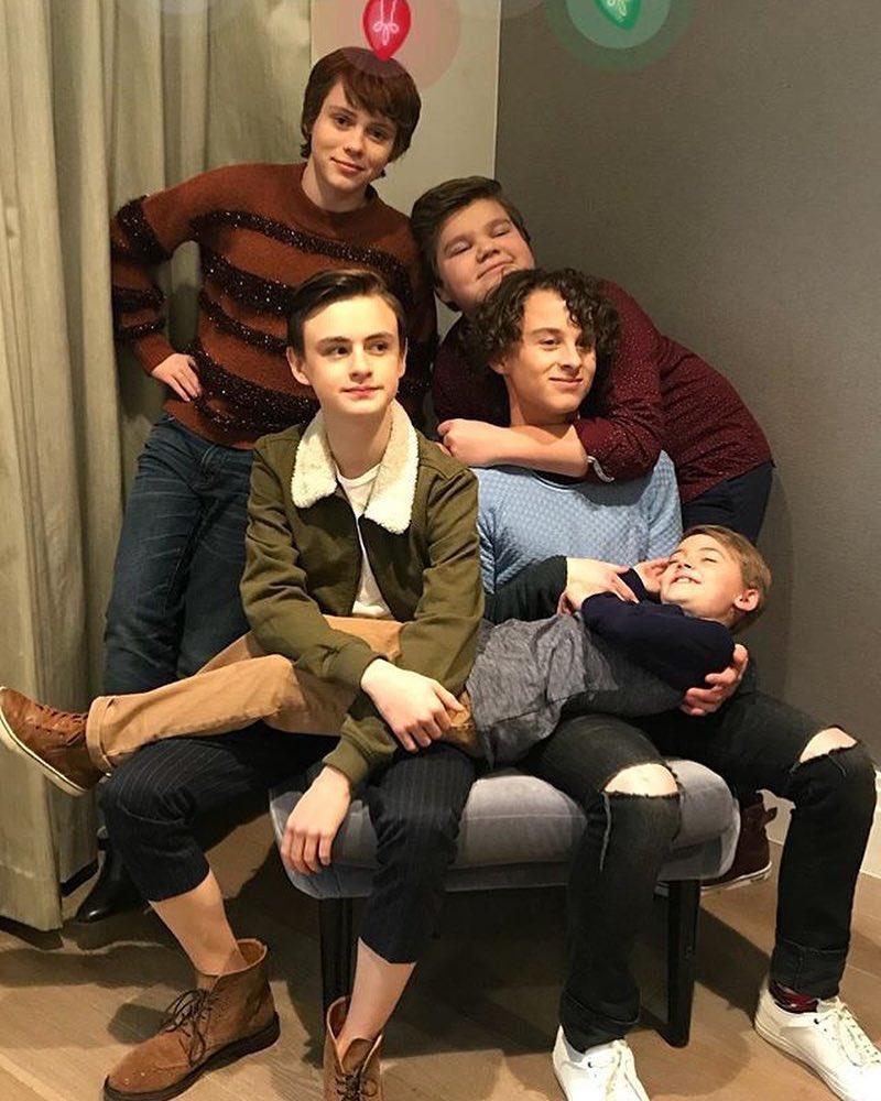 he’s in the process of hanging old photos of him and friends on the wall of his quarters, including these.