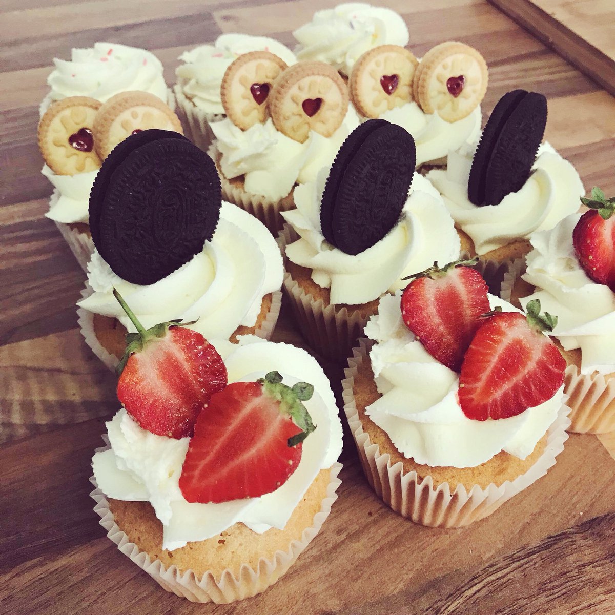 lovecakebakery's tweet photo. These vanilla cupcakes left the bakery this week... which would you go for? 🍓🍪🌈 #HappyWeekend https://t.co/7o20hImO8b