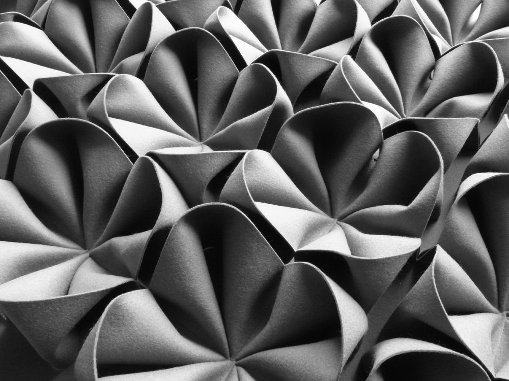 One of our famous contemporary Dani designs, capturing the light within their three dimensional forms. Perfect surface pattern or any interior. #Acoustic #textiles #wallcovering #wallpanel