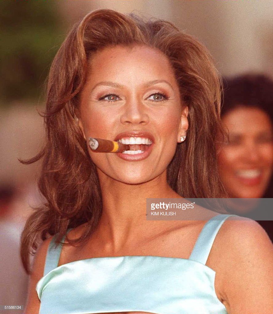 Vanessa Williams at the premiere of 'Eraser' (1996). The mint green color brought out her eyes and peep the clear plastic heels that are all the rage now. Plus, the cigar just topped the whole look off. A style icon!