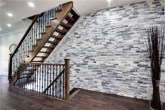 urbaneer's tweet photo. #StagingFail. A stone veneer wall and mediocre stair clash while a vase of sticks screams 2005. #TorontoRealEstate https://t.co/SkGlEZv6P9