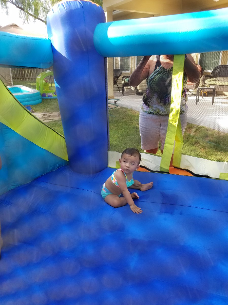 My grand baby. I love her too death on her 1st bonce and slide.