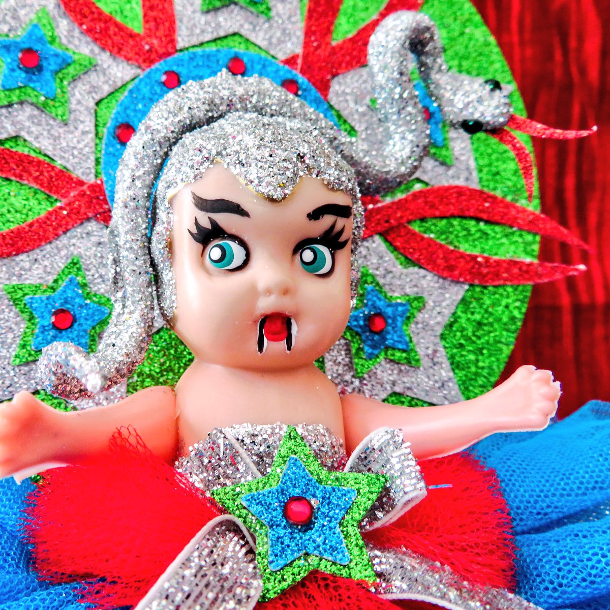 kylastephan's tweet photo. Introducing the completed Lair of the White Worm kewpie doll. Because goth and glitter go together. #gothnovjam #bramstoker #kewpiedoll #glitter #snakes #rwpchat https://t.co/kT7MayTz8B