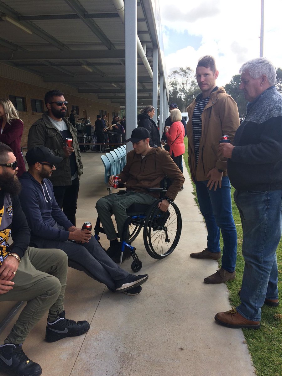 AFLNT's tweet photo. Great to see our friend Tai Martin-Page return home to be guest of honor at a game between his home club Southern Flinders Tigers &amp; Crystal Brook in SA incl an appearance by Darwin Buffaloes coach Matt Campbell https://t.co/aVP9p7eRj6 #territoryfooty #helptaiwalkagain https://t.co/f1Wc2XMtR1