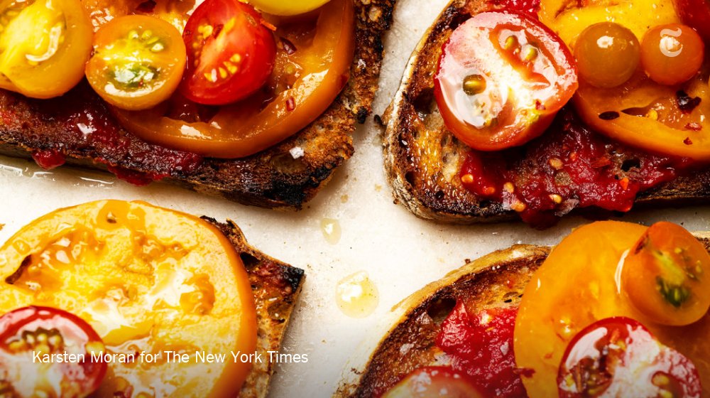 nytimes's tweet image. For a delicious way to eat summer tomatoes, try this garlicky tomato toast recipe nyti.ms/2LGL8GM