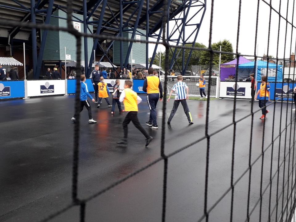 KilmarnockFC's tweet photo. Our @KillieCommunity coaches are keeping the kids entertained on our new syreet soccer pitch. 

Come along and have a kick about at #KillieOpenDay https://t.co/MTIuuZE9ZK