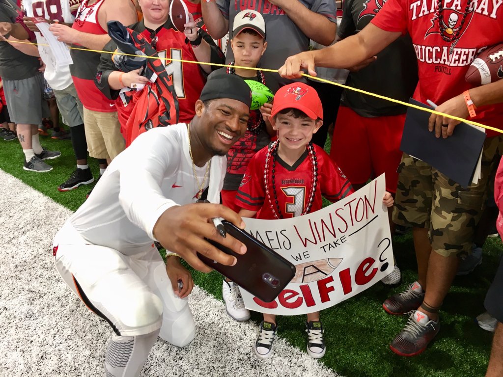 JennaLaineESPN's tweet photo. Jameis Winston has a swarm of fans around him today, at the Bucs' first public practice, including 5-year-old Cruz and his father Miguel. As you can see, Cruz got his wish.  https://t.co/gNSiXHLXr9 https://t.co/1Wx9mjN7sm