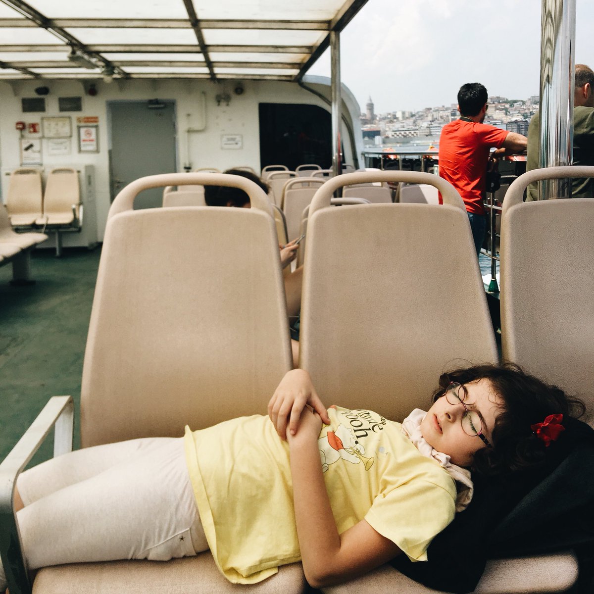 katierosebud's tweet photo. Does this little girl on this Turkish ferry not look like she’s about ready to step foot on a Wes Anderson film set??? IM OBSESSED WITH HER https://t.co/HoqoIqUYHE