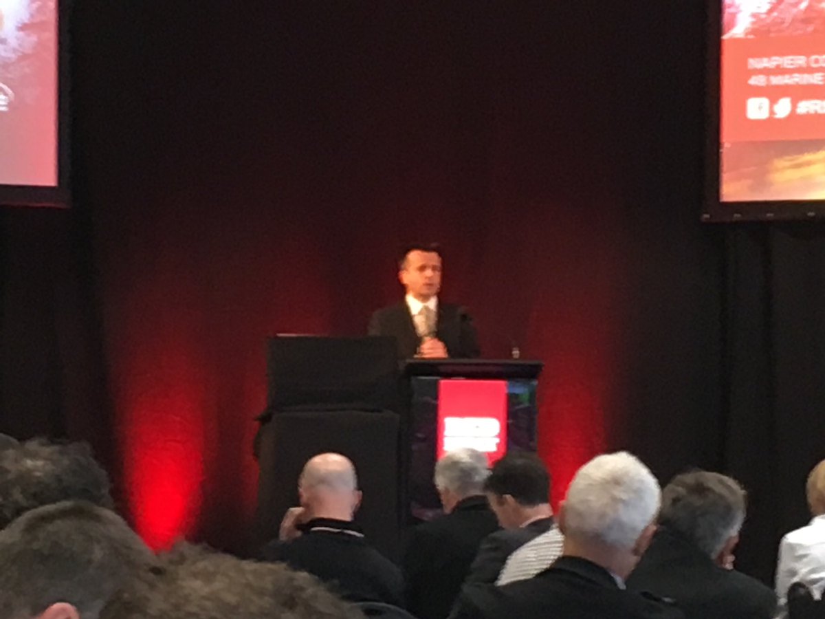 NZBeefLamb's tweet photo. Vangelis Vitalis, NZ chief negotiator speaking about trade at #rmsc2018. WTO agreement deliver 1 billion a year in tariff savings to the NZ red meat sector each year. https://t.co/ikeBWc2Drf