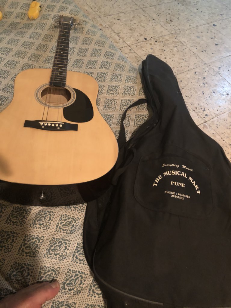 Feeling happy to get the family guitar back. My mother managed to bury it in the back yard of my house before ISIS confiscated the house. Except for two strings, the guitar spent a safe journey under the ground for three years. Music conquers death!