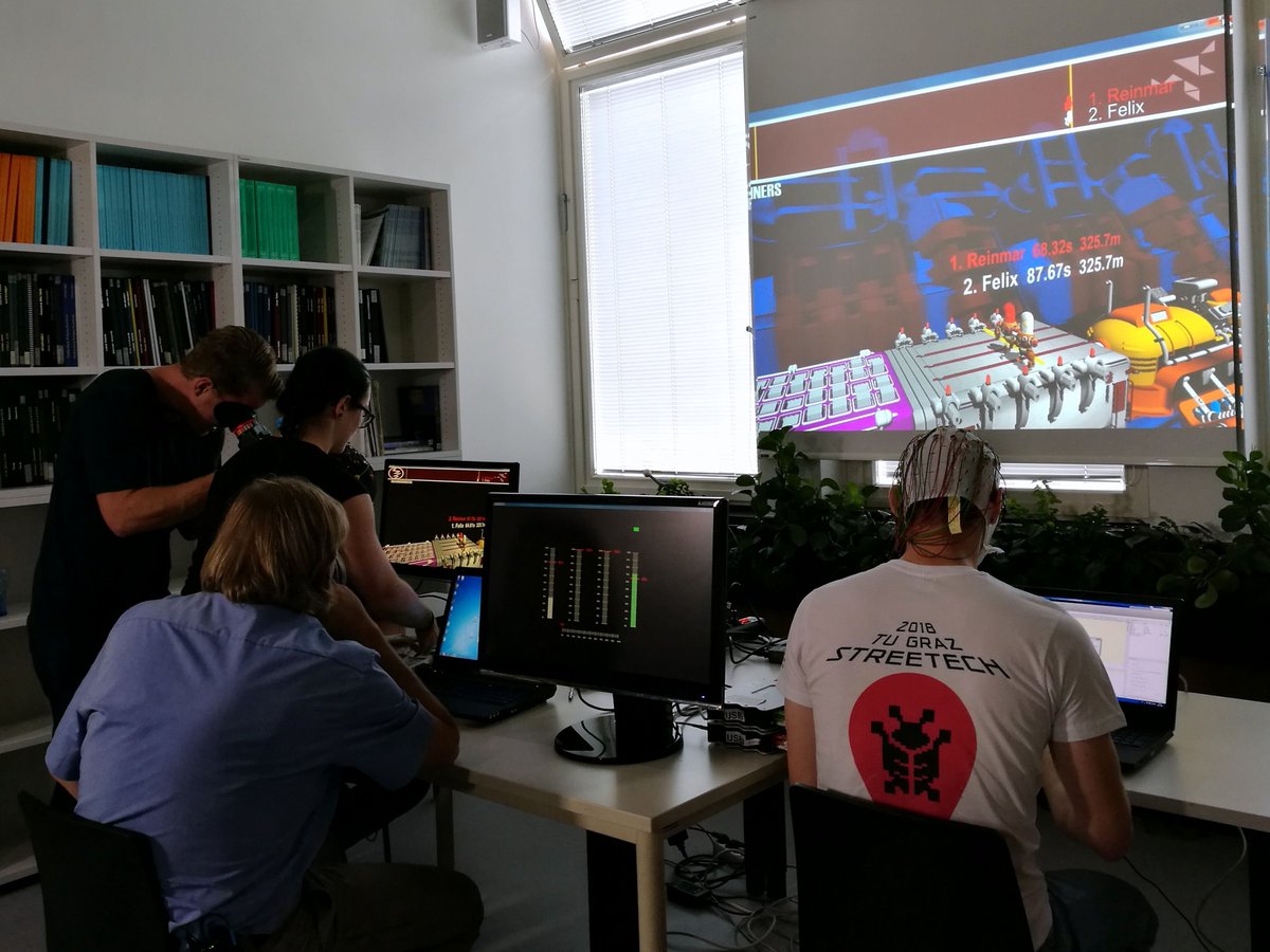 BCIseries2019's tweet photo. Last week, childrenβs TV channel #KiKA visited #GrazBCI Lab (@tugraz_csbme, @tugraz) led by Prof. @muellerputz. During their visit, manager of the Graz #BCI Racing #ππππ¦ππ’π«ππ πππ challenged moderator @felixseidai in the #CYBATHLONβs #Brainrunners game. #ErdeAnZukunft https://t.co/uiUY64xlDP