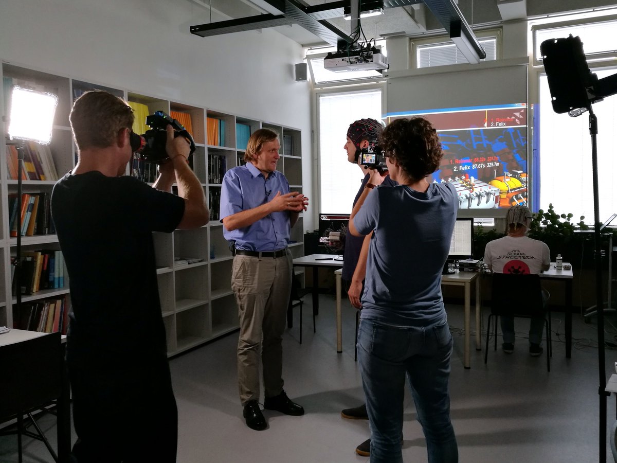 BCIseries2019's tweet photo. Last week, childrenβs TV channel #KiKA visited #GrazBCI Lab (@tugraz_csbme, @tugraz) led by Prof. @muellerputz. During their visit, manager of the Graz #BCI Racing #ππππ¦ππ’π«ππ πππ challenged moderator @felixseidai in the #CYBATHLONβs #Brainrunners game. #ErdeAnZukunft https://t.co/uiUY64xlDP