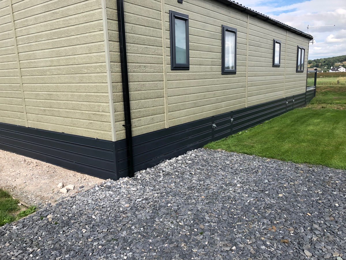 ABSundecksLtd's tweet photo. Why not add a touch of glass for that touch of class? Gorgeous glass panelled wraparound with cream deck boards on this lovely home at #Lakesway, its slate grey handrails and skirting complimenting the home perfectly. https://t.co/T12A30mNlF