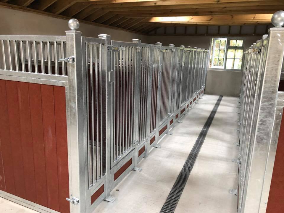 StablesOnline1's tweet photo. Phase 1 installation of 10 custom dog kennels near South Molton #Devon Galvanised grilled panels with Red recycled plastic boarding. External doors and gates still to be made and fitted as well as sealed and bonded rubber flooring by @HorseMatsPlus #localjob https://t.co/m7MkcJJDV9
