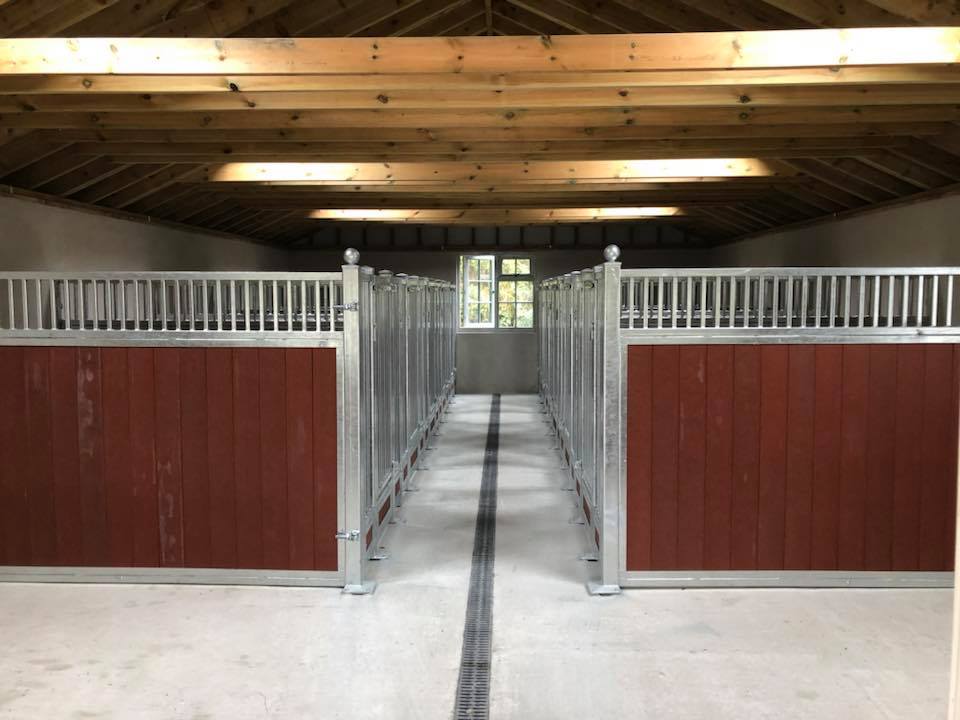 Phase 1 installation of 10 custom dog kennels near South Molton #Devon Galvanised grilled panels with Red recycled plastic boarding. External doors and gates still to be made and fitted as well as sealed and bonded rubber flooring by <a href="/HorseMatsPlus/">Horse Mats Plus</a> #localjob