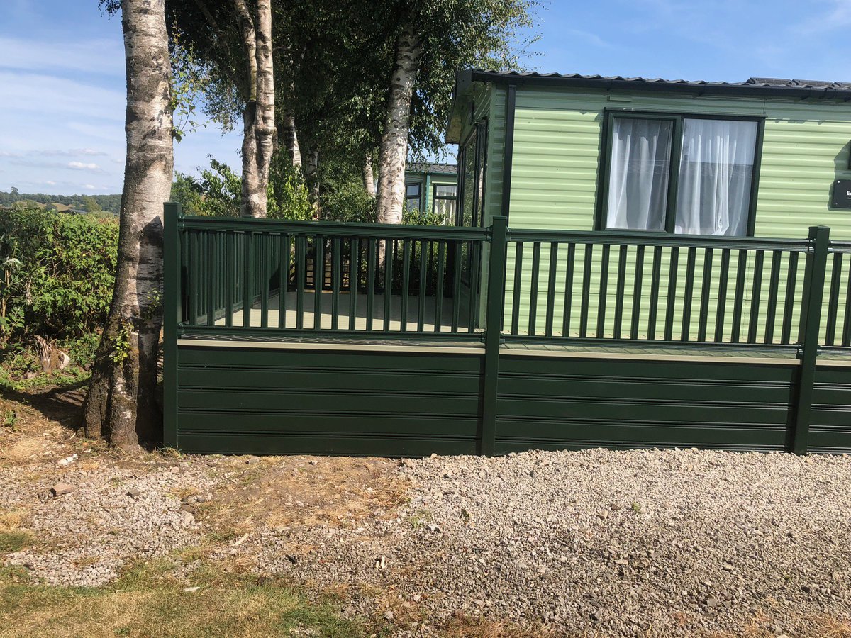 ABSundecksLtd's tweet photo. Matching itβs beautiful green surroundings and showcasing our fitters work with a tree to work around too! The lovely forest green wraparound with cream deck boards on this @VictoryLeisure Echo 36 at #Lakesway is the perfect area for such a stunning view. https://t.co/9U7Rtl2AKy