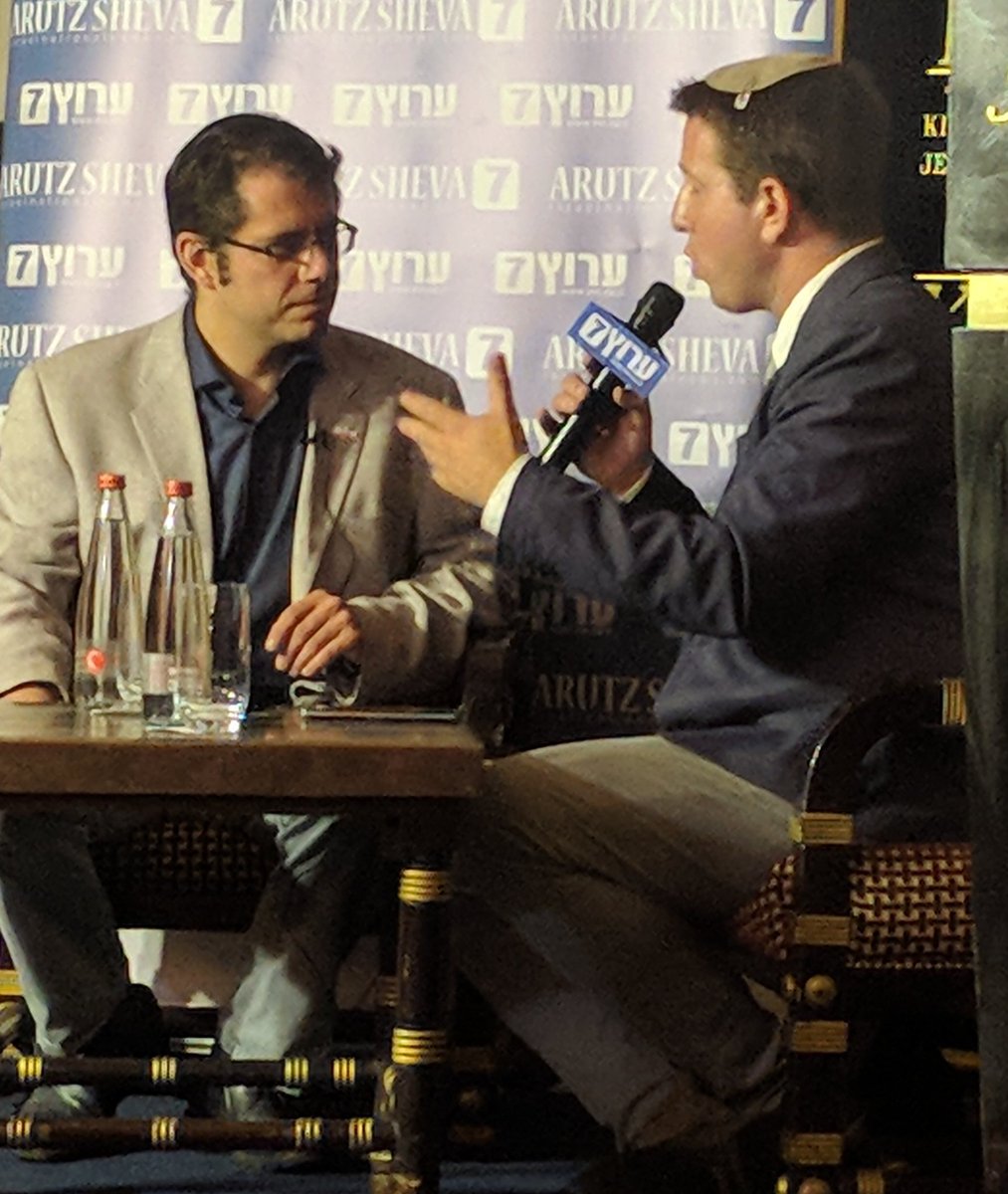YishaiFleisher's tweet photo. The brilliant @EVKontorovich discusses the legality and value of the Nationality Law in front of an audience which includes @GovMikeHuckabee and @Scaramucci #InJerusalem https://t.co/l7fylo6Nga