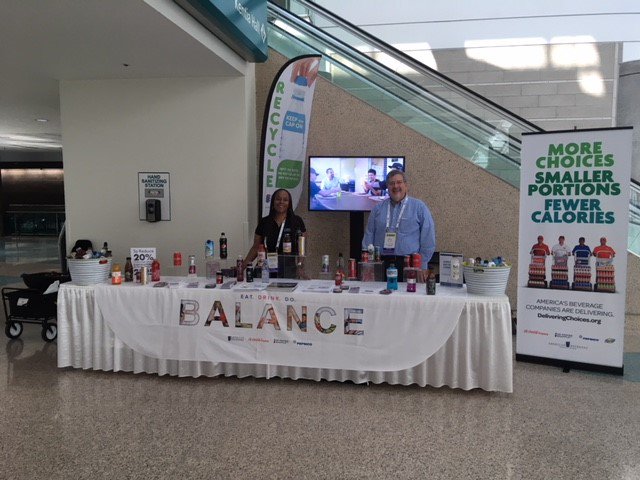 AmeriBev's tweet photo. Attending #NCSLSummit? Stop by our table at registration to find out about our voluntary commitment to reduce sugar consumed from beverages, and to help Americans #BalanceCalories by providing more choices with less sugar. We'll be here until 1:30 pm P.T. https://t.co/dIdqQJBks7 https://t.co/ovRfgPyJO9