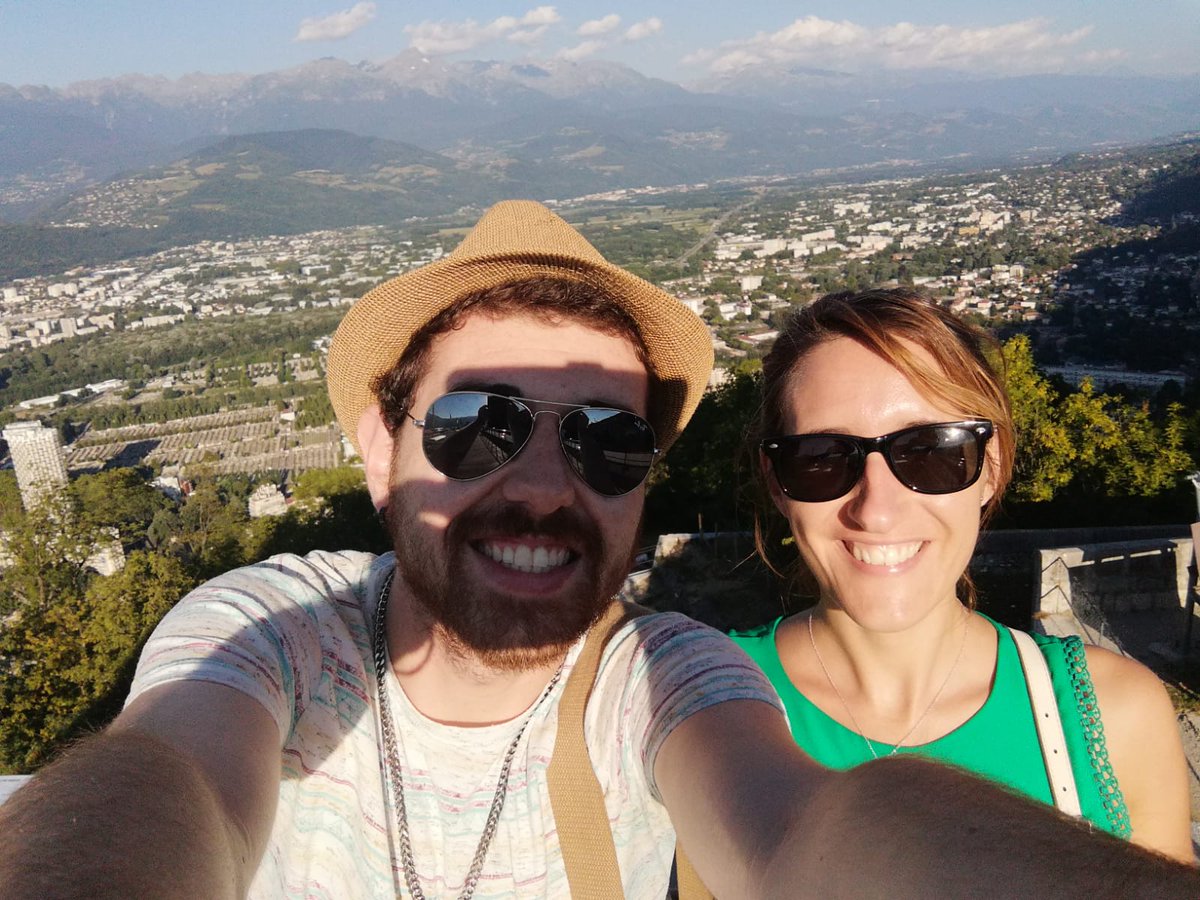 Train2Target's tweet photo. Elisabete Moura has started her secondment in Grenoble 🇫🇷 by taking a look at the city from above with fellow-ESR @TiagoBaeta7 🏔️🎑 She'll spend her secondment at the group of Jean-Pierre Simorre @IBS_Grenoble @CNRS  👩‍🔬🦠⚛️🧲. https://t.co/bgAqAx9HbR