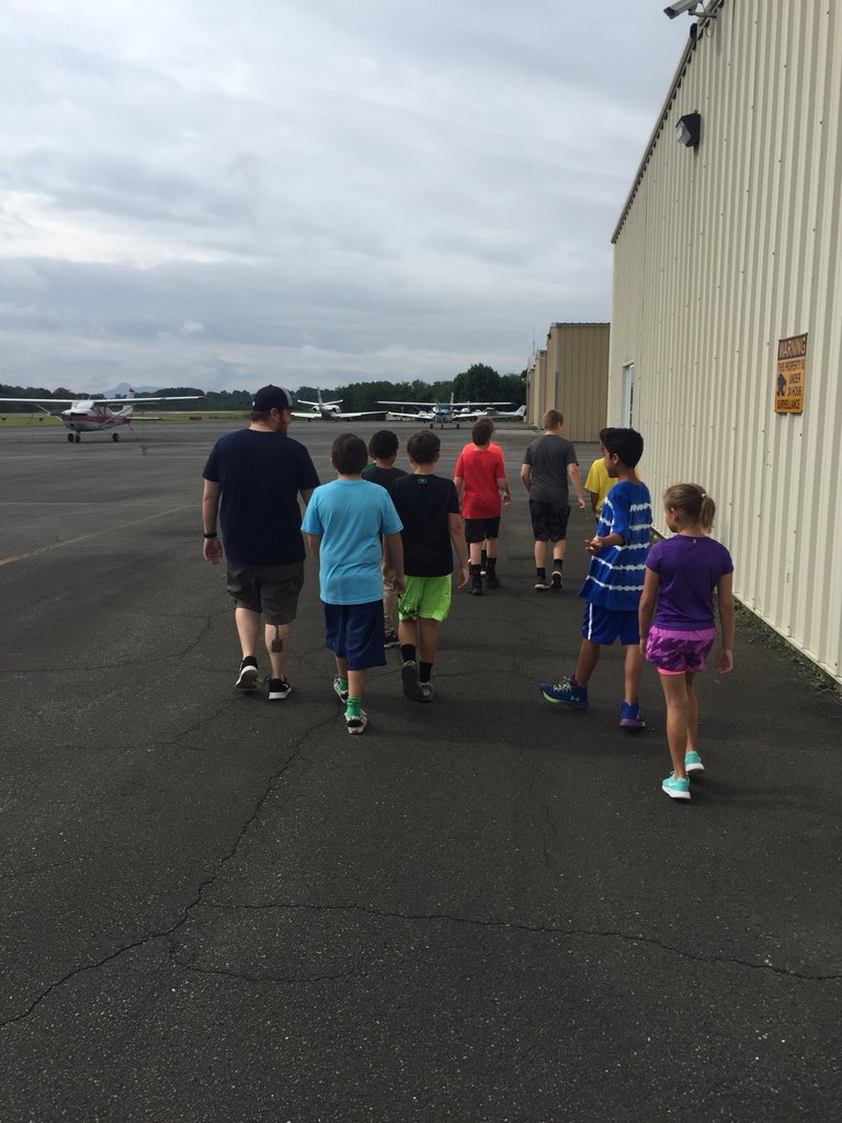 murph12_l's tweet photo. This week at camp we are reading the novel Hatchet and bringing it to life through activities, field trips and guest speakers. This morning we visited the Surry County airport to see aircraft similar to the one mentioned in the book! #MACSAwesome #MASummer #JOFamily #JOLeaders https://t.co/qIjPla4Flz