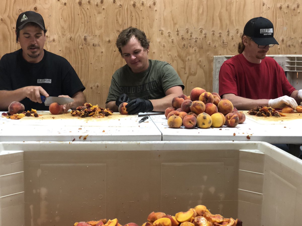 KC, Scott and Greg cutting 1500 lbs of peaches for an exciting brew this week!🍻🍑