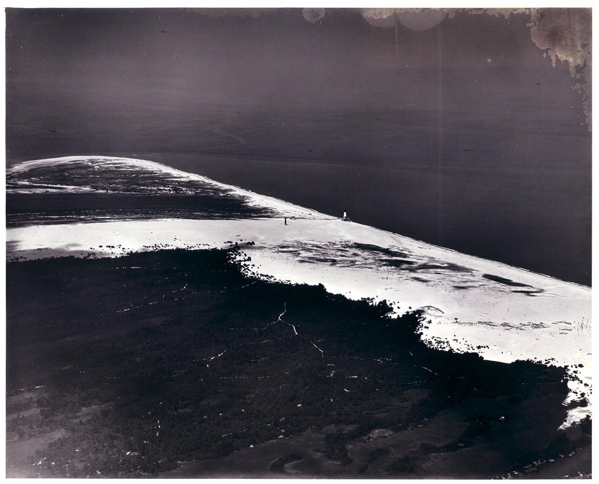 hagleymuseum's tweet photo. Today on #NationalLighthouseDay we’re sharing these photos of the #CapeHenlopen Light from our digital archives. These were taken as part of an aerial survey in 1925. The lighthouse collapsed into the sea in 1926 after its sandy foundation eroded. #hagleylibrary #delmarvahistory https://t.co/w87DcSIt1N