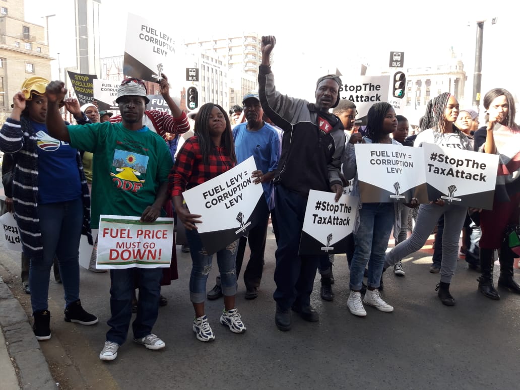 FreedomMVMT_SA's tweet photo. South Africans are gathering in their numbers outside National Treasury in Tshwane!

We are here to tell government; #StopTheTaxAttack

The #FuelPriceHike must fall! https://t.co/o7cVjT1gXx