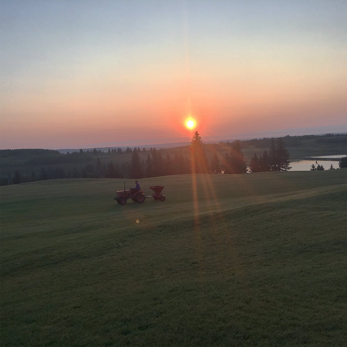 Fairway fertilizing is underway this morning. #livingstone #lelyspreader  #sunrise #golfyyc