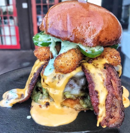 karicsteele's tweet photo. Totcho Burger at @Slaters5050: Carne Asada-Infused Beef Patty, Tater Tots, Beer Cheese, GUAC, Jalepeños + BACON On Bacon-Infused Buns #NationalAvocadoDay https://t.co/MnUHnTGHUM