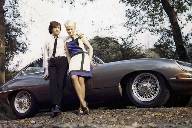 Eric Stewart of 10cc and his wife Gloria pose in 1970 with a E Type Jaguar ...