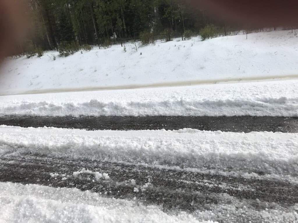 GlobalCalgary's tweet photo. Many parts of Alberta are under severe thunderstorm warnings and watches tonight and this was the scene west of Nanton, Alta. not too long ago when hail covered Highway 22 #abstorm COURTESY: Cindy and Doug McFadden https://t.co/8rsu0zfSyY