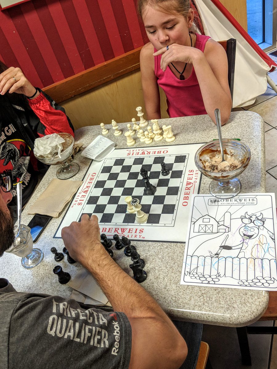 tarable_one's tweet photo. Uncle Jeffrey and munchkin playing a serious game of chess with a side of ice cream. https://t.co/9LqZyjjJMo