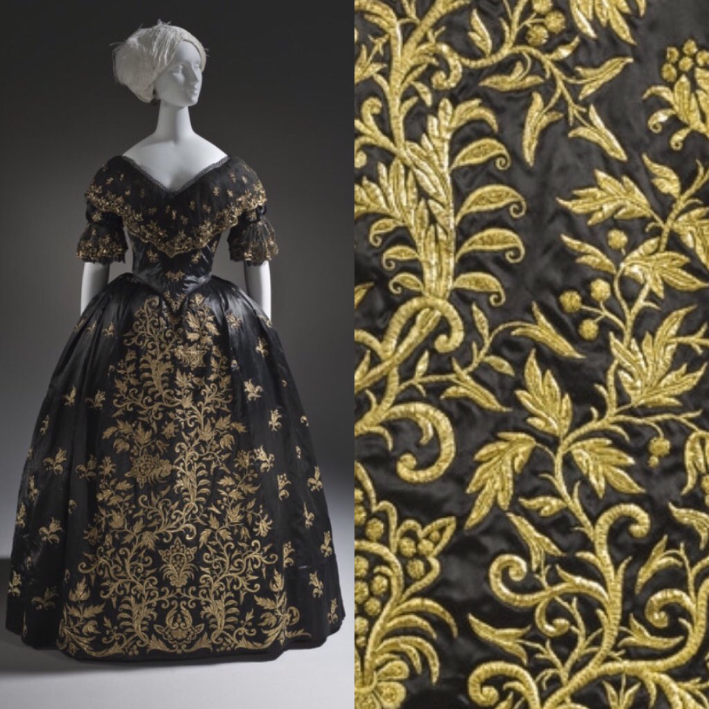 Black magic in the shape of an #1840s formal gown from Portugal. Extensive  scrolls of metallic gold embroidery cover the front of the skirt, complex  designs worked in a less forgiving material.